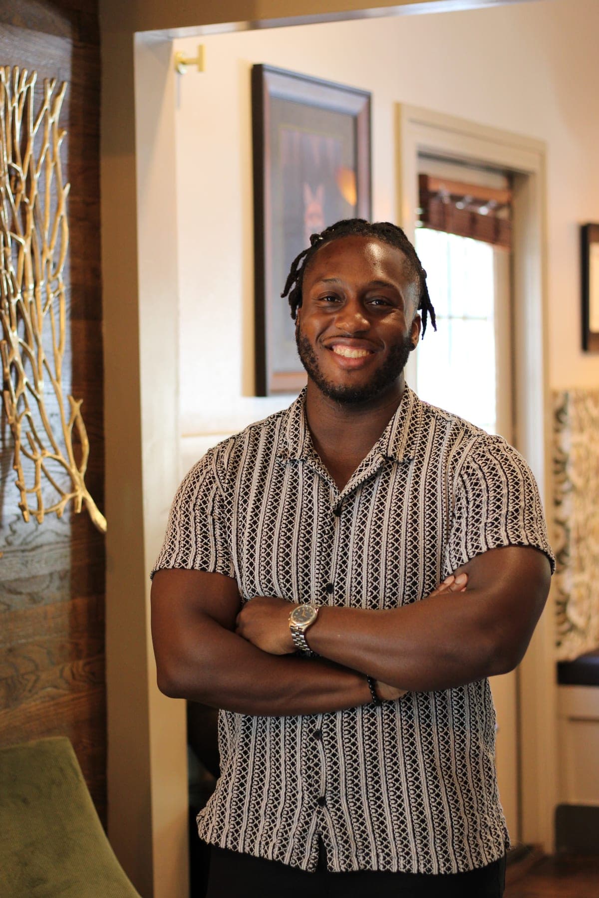 Jonathan Hazeley, arms folded, smiling